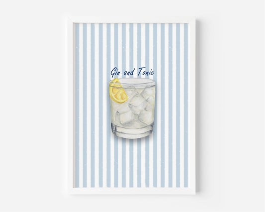 A framed art print featuring a watercolor illustration of a Gin and Tonic cocktail with a lemon slice, set against a background of light blue and white vertical stripes.