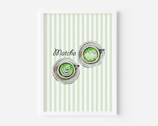 A framed art print featuring a watercolour illustration of two matcha lattes viewed from above with latte art, set against a background of vertical pale green and white stripes, with the word 'Matcha' in black script. The print is shown in a white frame against a light grey wall.