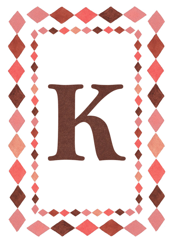 Watercolour letter K art print in warm brown with a double harlequin diamond border in coral pink, blush and brown on a white background.