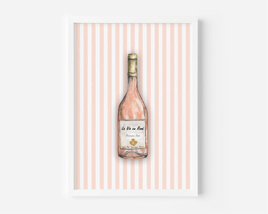 A framed art print featuring a watercolor illustration of a pink wine bottle centered on a background of vertical light pink and white stripes.
