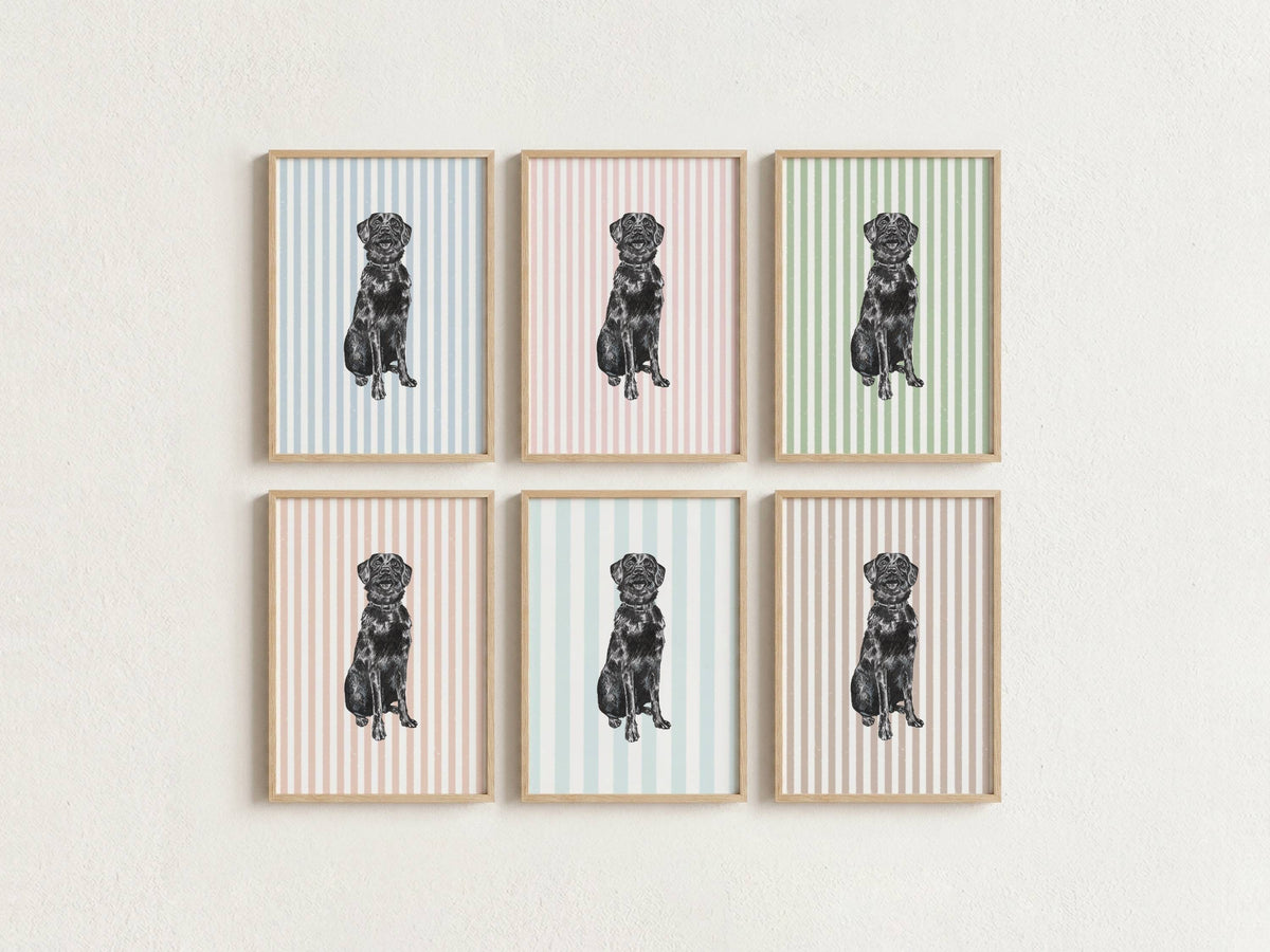 Six framed wall art prints arranged in two rows of three on a light textured wall. Each print shows a black dog illustration centered on pastel vertical stripes in different colors: light blue, pink, and sage green, with light wood frames.