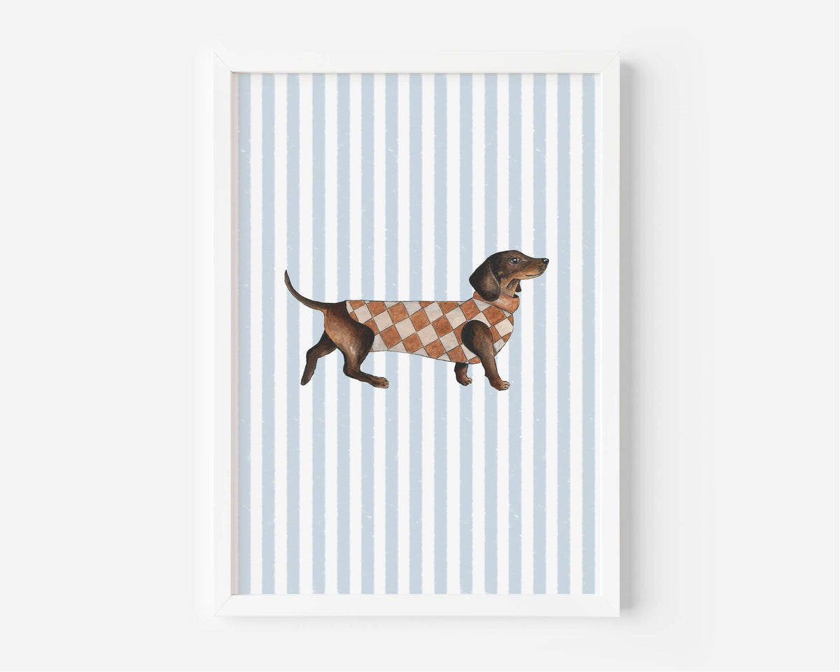 A framed art print featuring a brown dachshund wearing a brown and beige argyle sweater, set against a background of light blue and white vertical stripes.