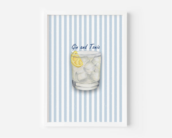 A framed art print featuring a watercolor illustration of a Gin and Tonic cocktail with a lemon slice, set against a background of light blue and white vertical stripes.
