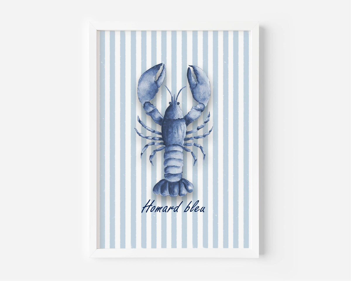 A framed art print featuring a blue lobster illustration on a background of light blue and white vertical stripes, with the French text 'Homard bleua' written below. The print is housed in a clean white frame and is displayed against a neutral light gray wall.