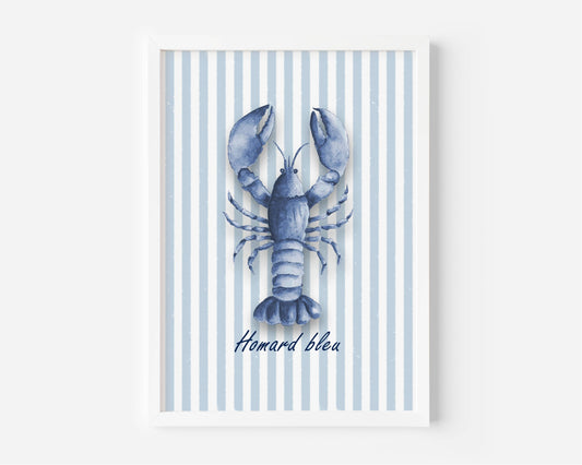 A framed art print featuring a blue lobster illustration on a background of light blue and white vertical stripes, with the French text 'Homard bleua' written below. The print is housed in a clean white frame and is displayed against a neutral light gray wall.