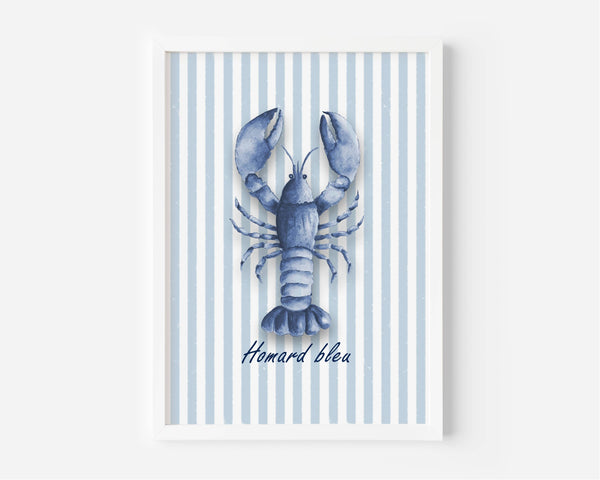 A framed art print featuring a blue lobster illustration on a background of light blue and white vertical stripes, with the French text 'Homard bleua' written below. The print is housed in a clean white frame and is displayed against a neutral light gray wall.