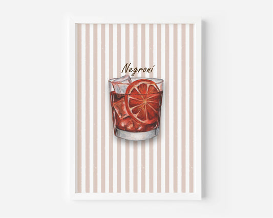 A framed art print featuring a watercolour illustration of a Negroni cocktail in a tumbler glass with ice and an orange slice garnish, set against a background of vertical beige and white stripes. The print is shown in a white frame against a light grey wall.