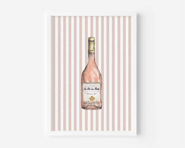 A framed art print featuring a watercolor illustration of a pink wine bottle centered on a background of vertical beige and white stripes.