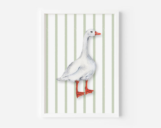 A framed art print featuring a watercolor-style white goose with red-orange beak and legs, standing against a background of vertical light green and white stripes.