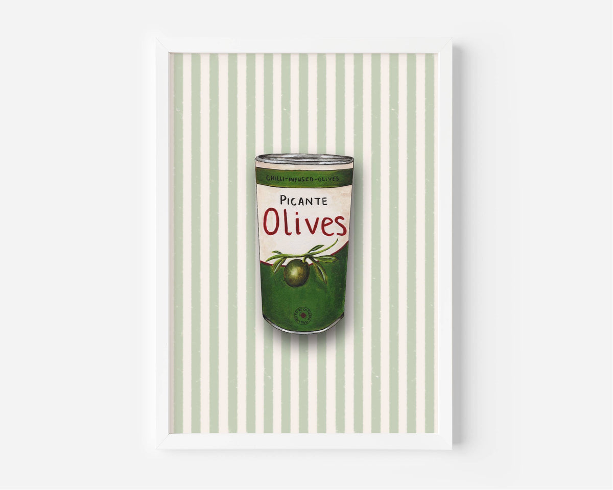 A framed art print featuring a retro-style illustration of a green can of olives with the text 'PICANTE Olives' on a background of pale green and white vertical stripes.