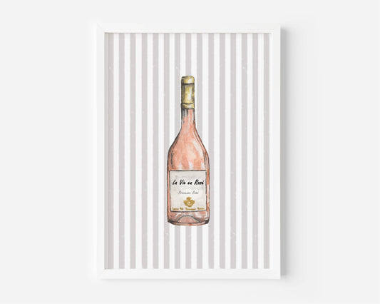 A framed art print featuring a watercolor illustration of a pink wine bottle against a background of vertical gray and white stripes, displayed on a clean white wall.