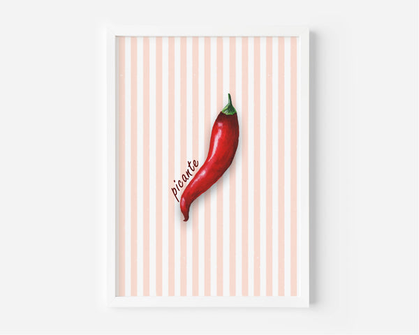 A framed art print featuring a single red chili pepper on a background of vertical peach and white stripes, with the word 'picante' written in cursive next to it.