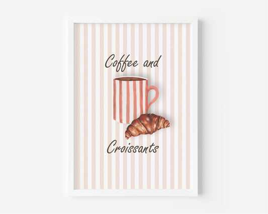 A framed wall art print featuring a pink and white striped background with the words 'Coffee and Croissants' in black script, plus an illustration of a pink striped mug and a croissant.