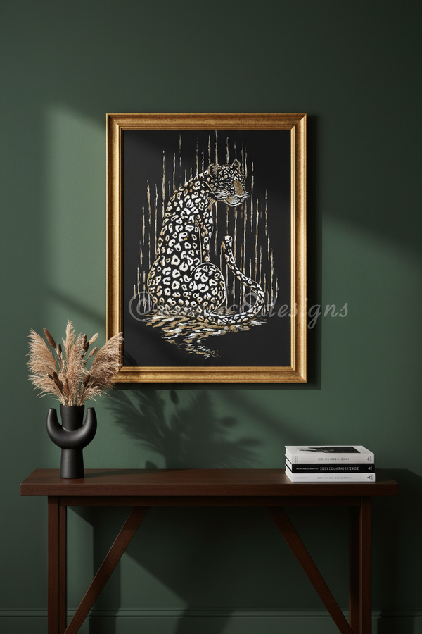 Framed wall art featuring a spotted leopard illustration in white and gold on a black background, displayed above a dark wood console table against a deep green wall.